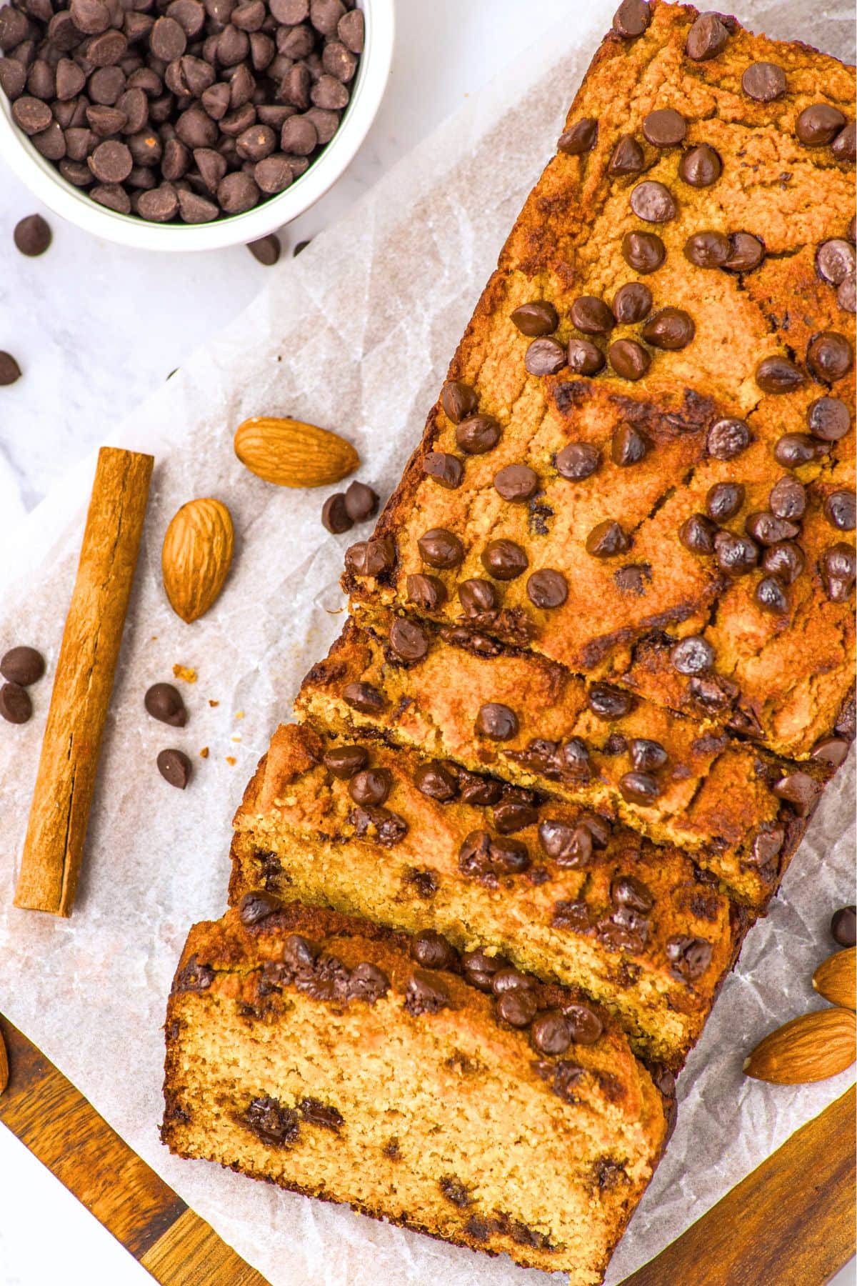 Gluten-Free Almond Flour Pumpkin Bread (Not Dense) Top down view of a sliced loaf of gluten-free almond flour pumpkin bread