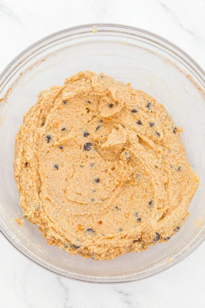 Chocolate chip almond flour pumpkin cookie dough in glass bowl.
