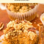 Half-eaten almond flour pumpkin muffin on muffin liner