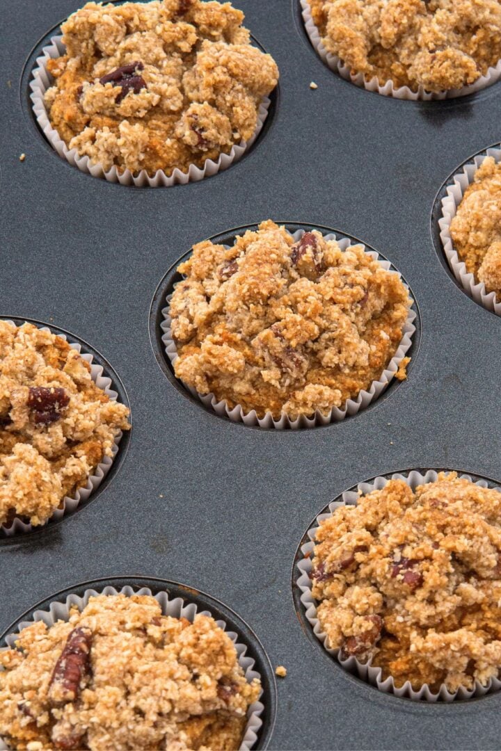 Freshly baked almond flour pumpkin muffins in muffin pan.