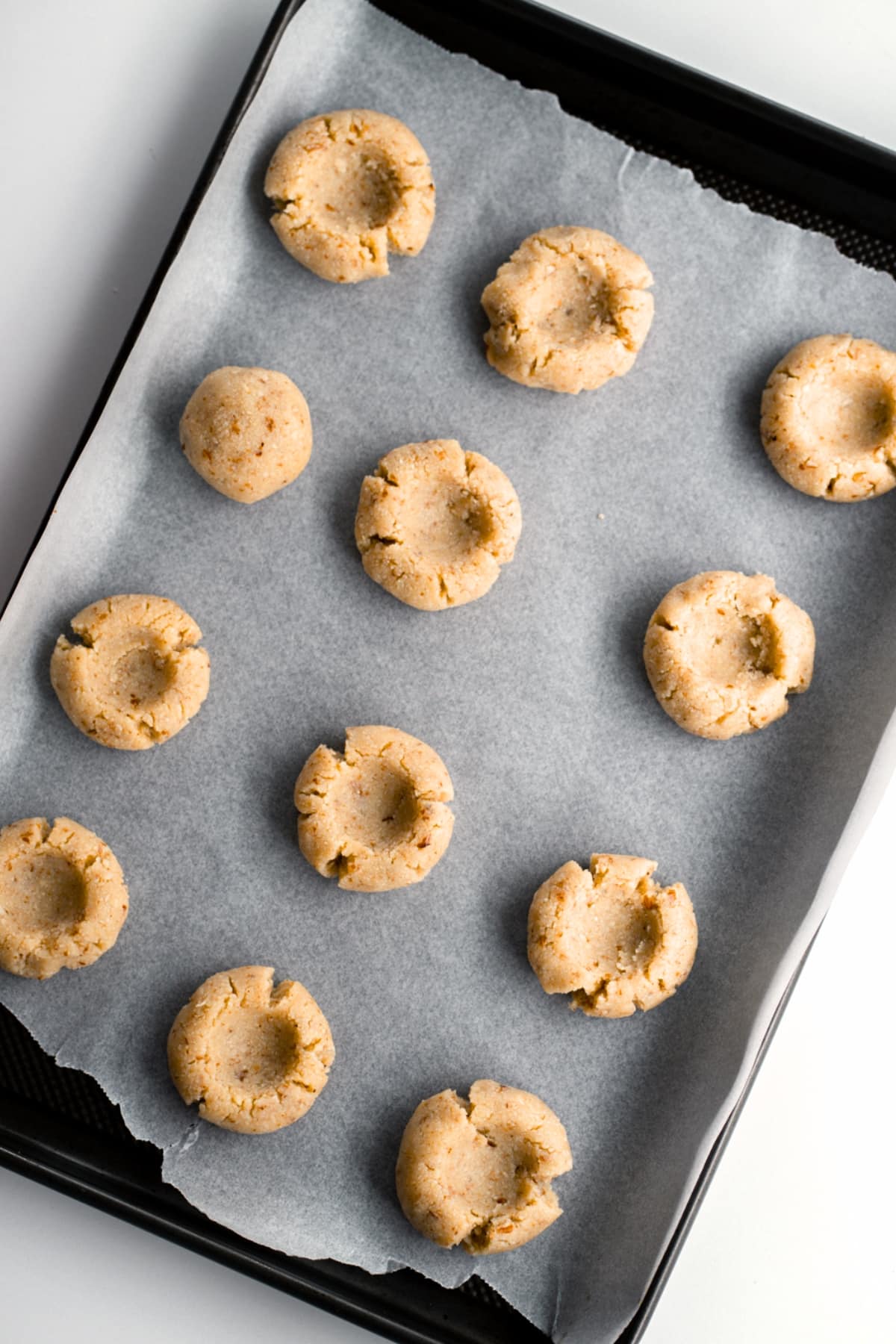 Almond flour cookie dough on parchment paper.