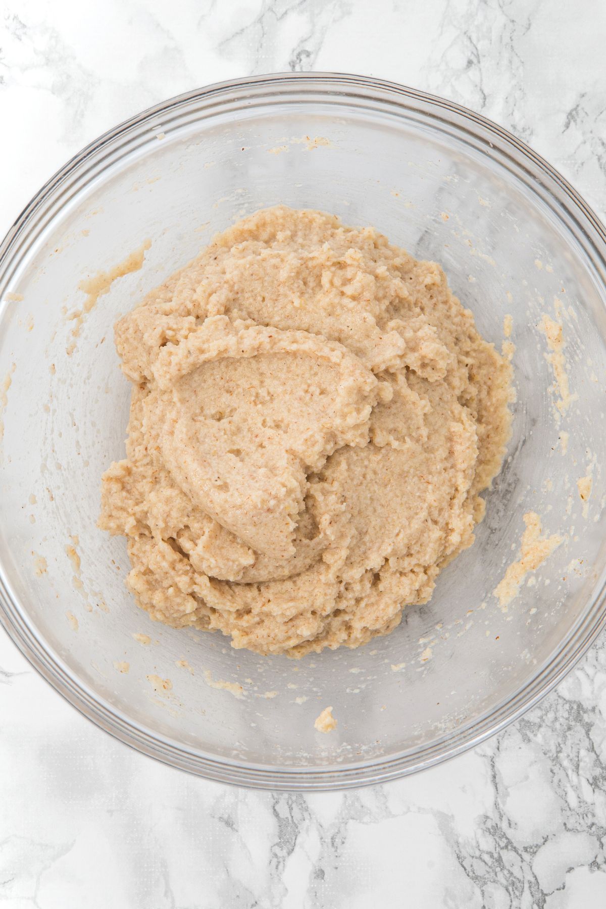 Bread dough mixture in glass bowl