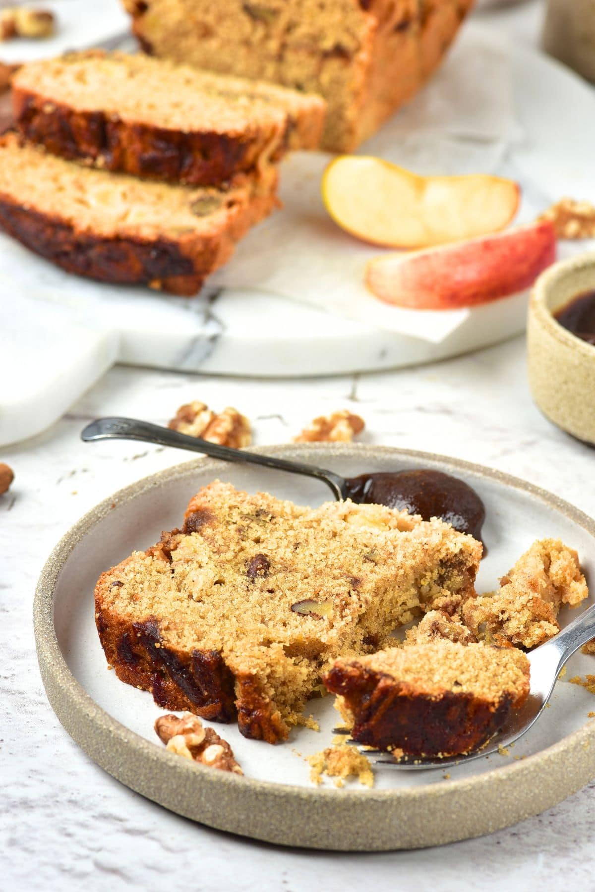 A slice of gluten-free dairy-free apple butter bread on plate.