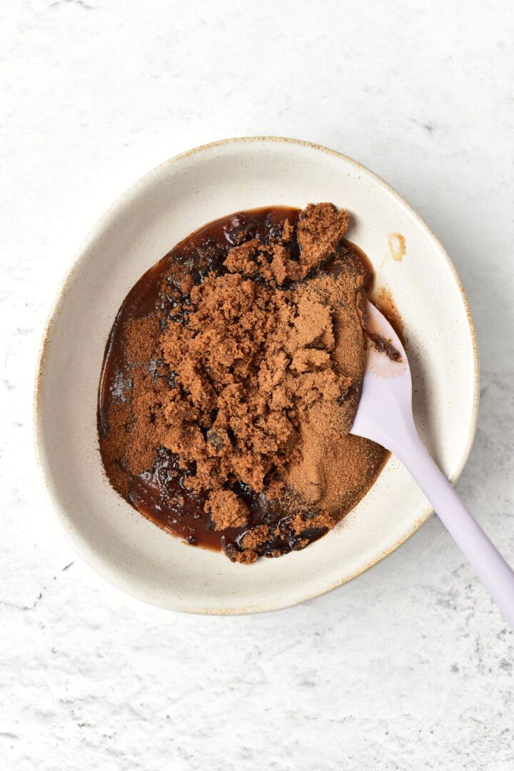 Brown sugar, apple butter and spices in a small bowl