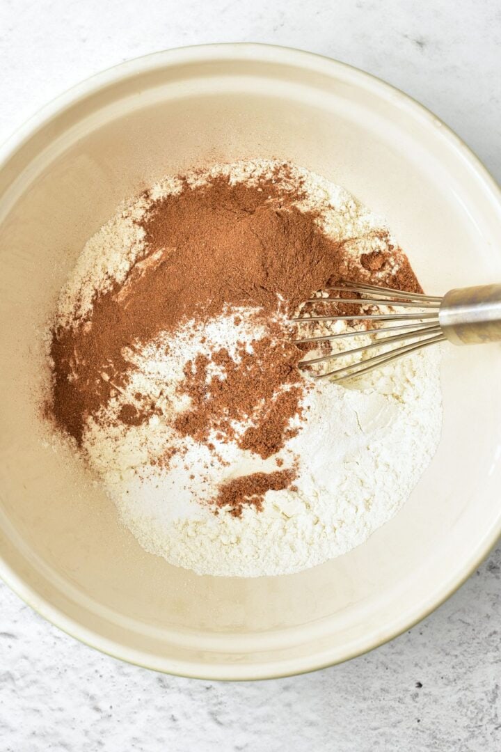 Gluten-free flour, spices and baking powder in bowl.