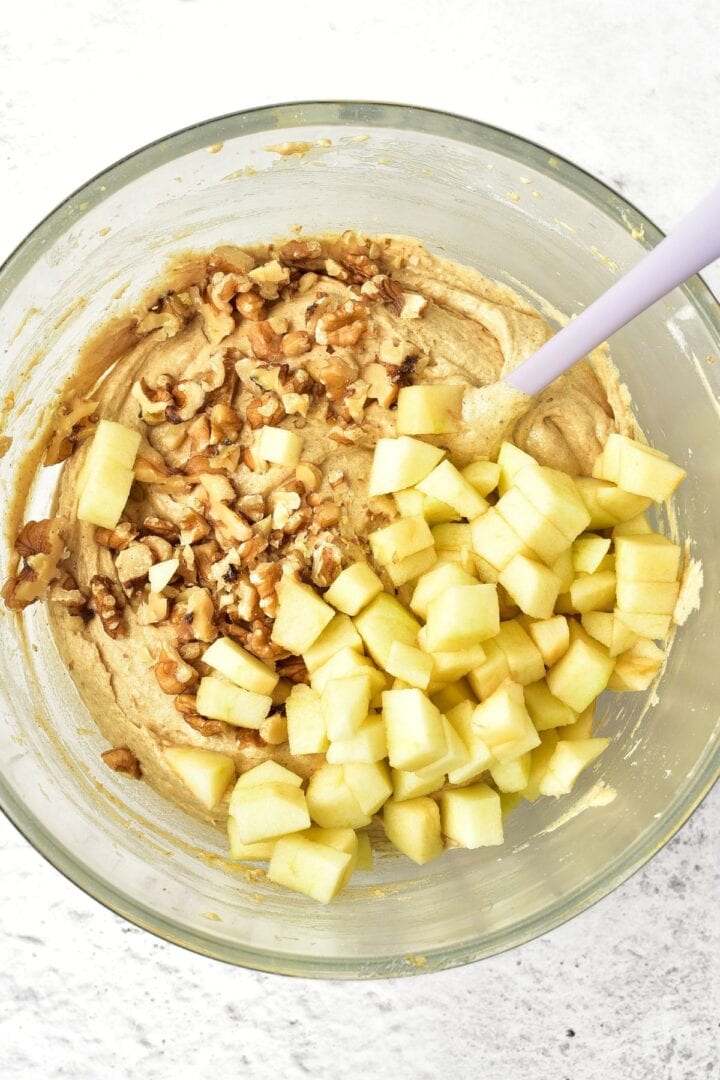 Cubed apples and chopped walnuts on top of batter.