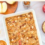 Top down view of apple baked oatmeal on marble board