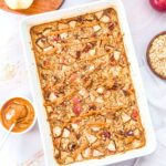 Top down view of apple cinnamon baked oatmeal in casserole dish