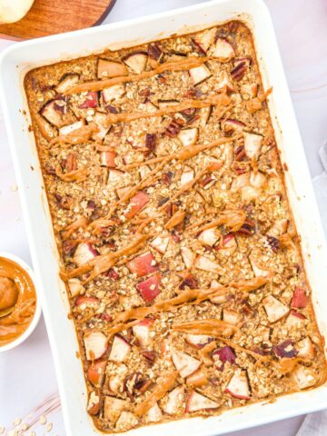 Top down view of apple cinnamon baked oatmeal in casserole dish