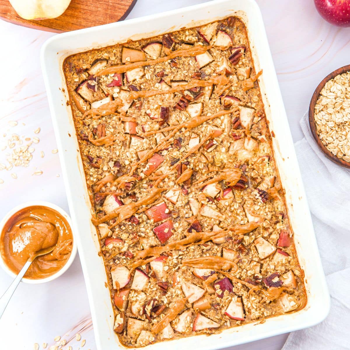 Top down view of apple cinnamon baked oatmeal in casserole dish