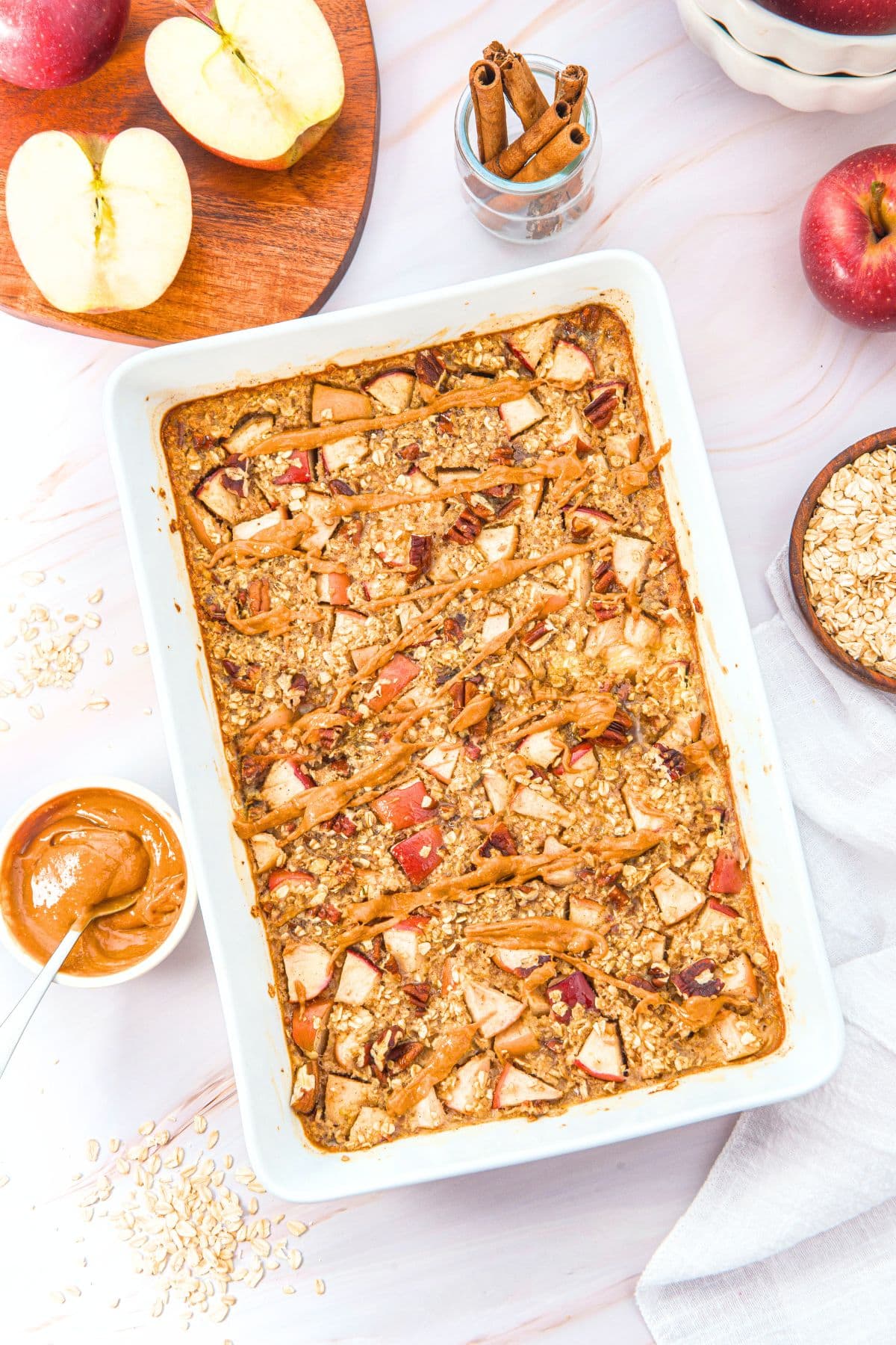 Apple Baked Oatmeal (Gluten-Free, Dairy-Free) Top down view of apple cinnamon baked oatmeal in casserole dish