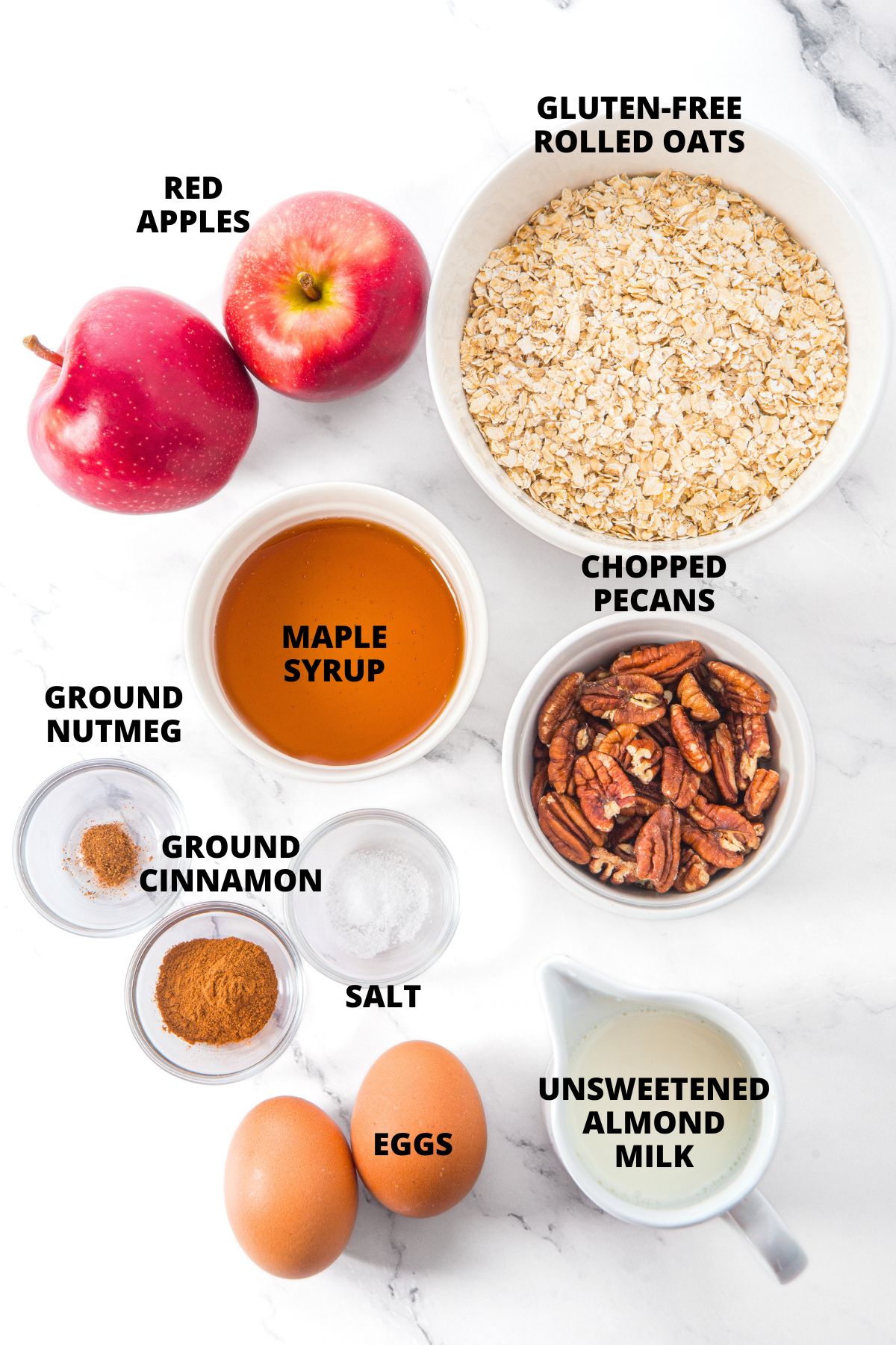 Apple Cinnamon Baked Oatmeal Recipe (Gluten-Free, Dairy-Free) Ingredients for apple cinnamon baked oatmeal recipe laid out on marble board.