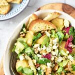 Top down view of a bowl of apple walnut blue cheese salad
