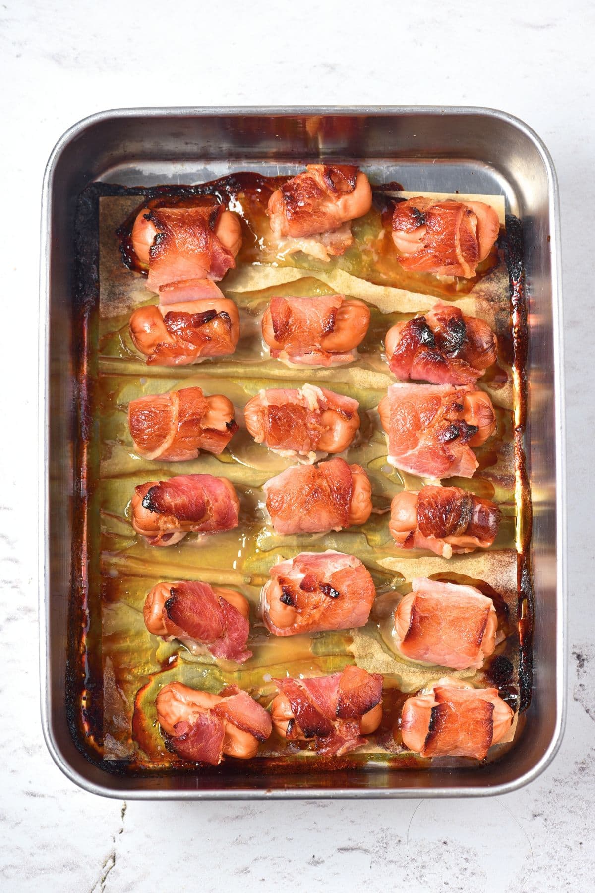 Freshly baked bacon-wrapped little smokies