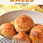 Forks resting on a bowl with chicken balls.