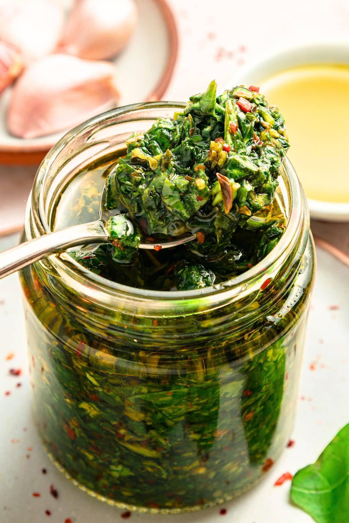 Holding up a spoonful of vegan chimichurri sauce