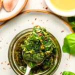 Holding up a spoonful of basil chimichurri sauce.