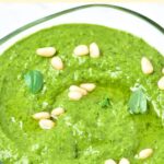 Up close view of a bowl of pesto dressing