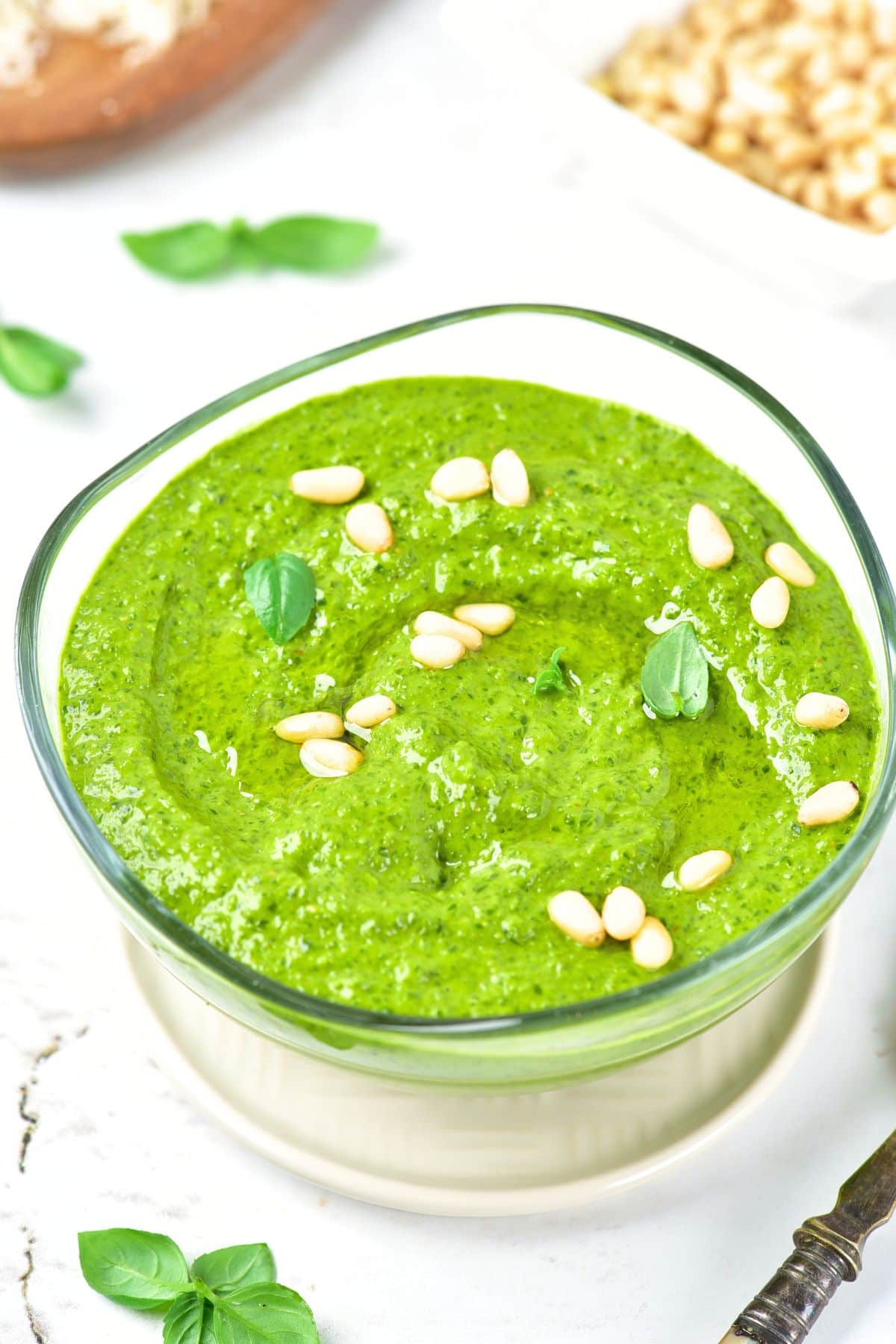 Up close view of bowl of basil pesto dressing.