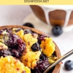 Up close shot of a bowl with blueberry dump cake.