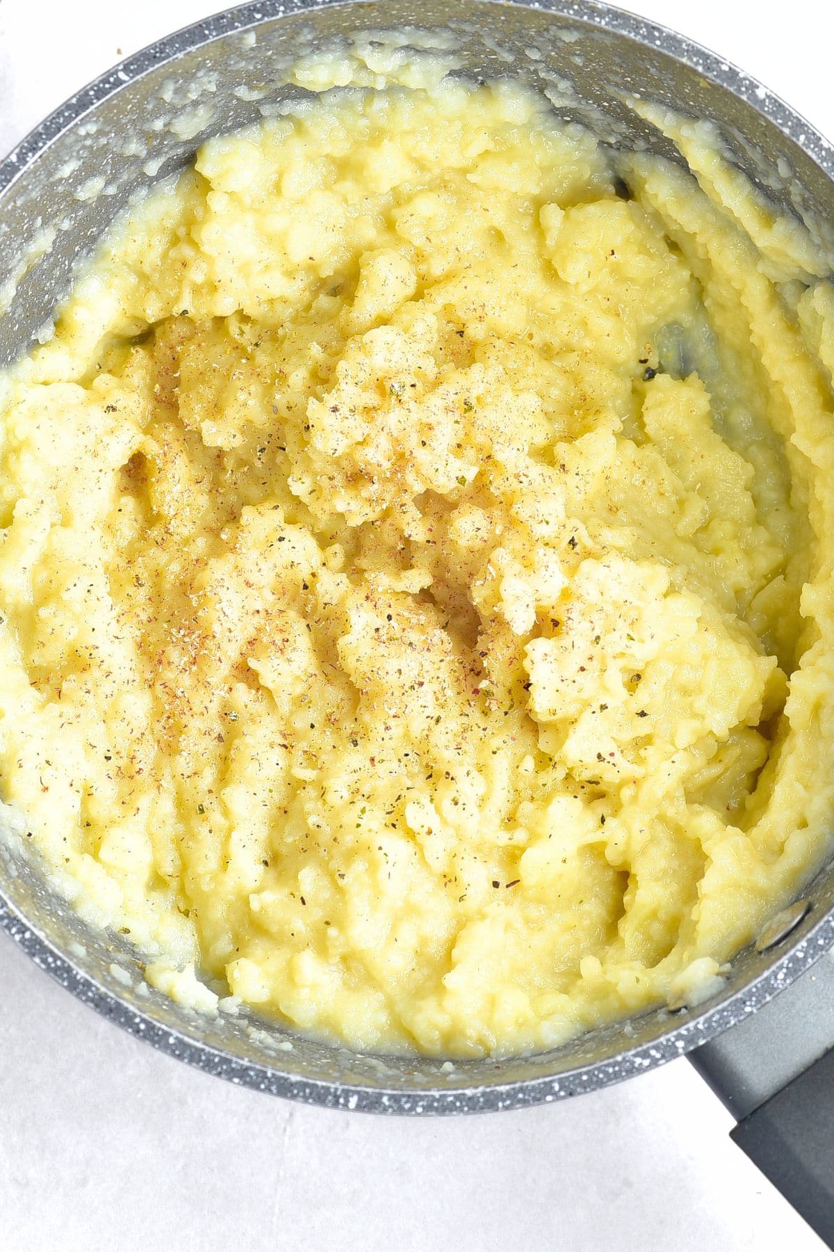 A pot with mashed cauliflower and potatoes
