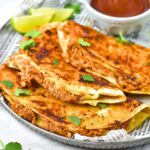 Chicken birria tacos with sauce on plate