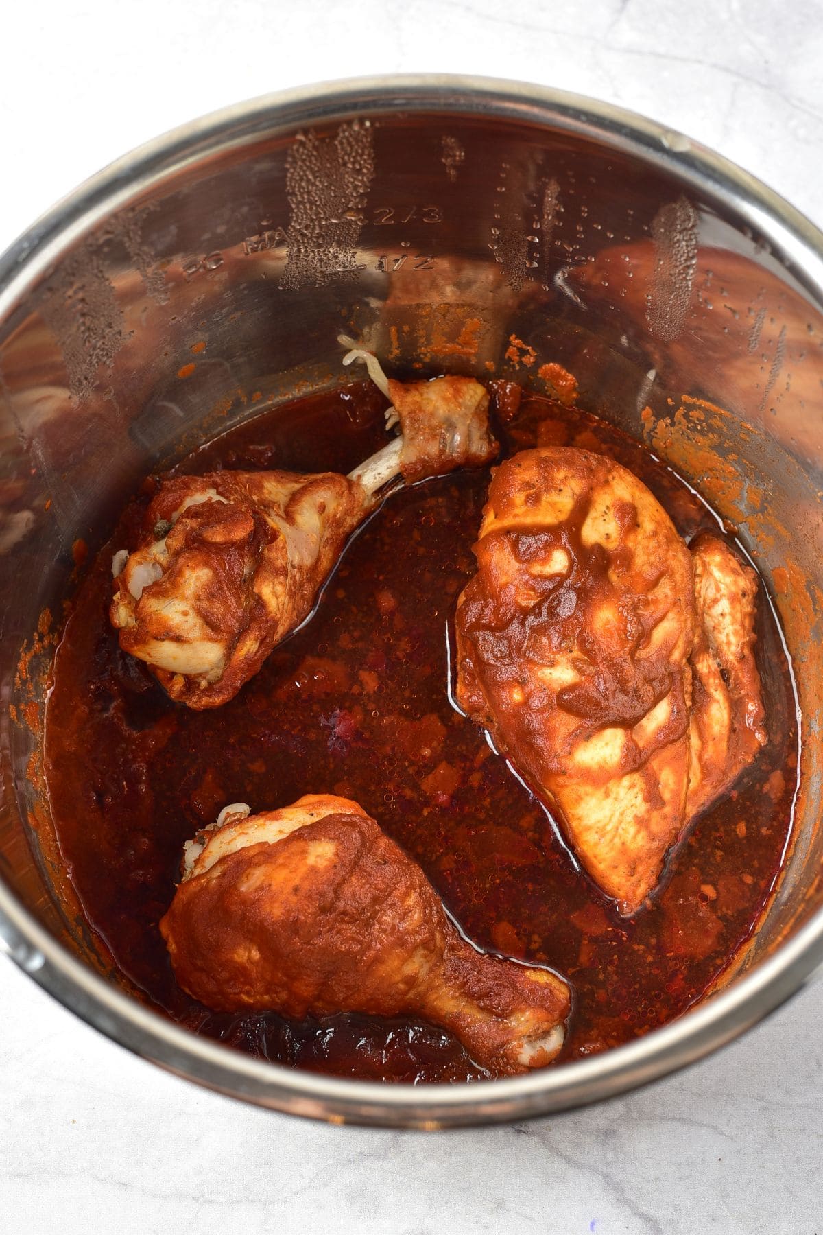 Chicken and sauce in pot