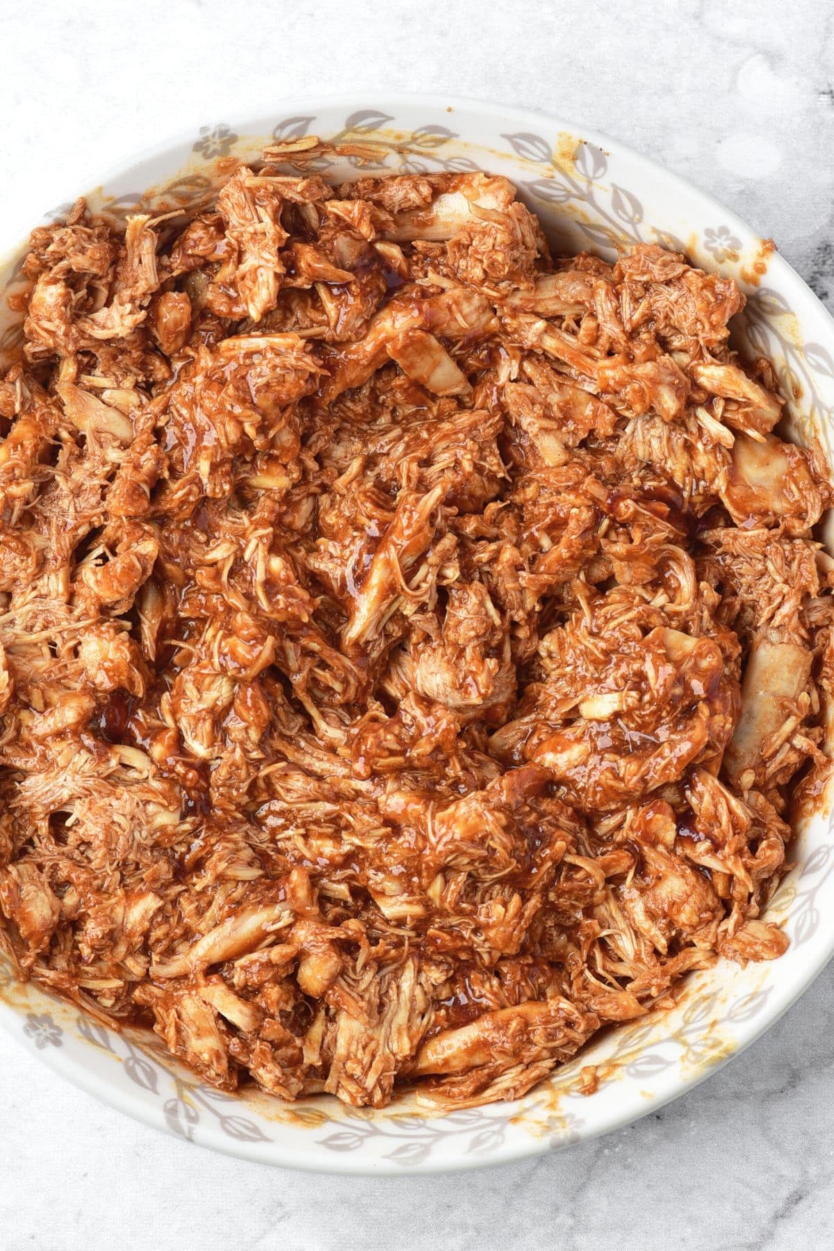 A bowl of shredded chicken birria