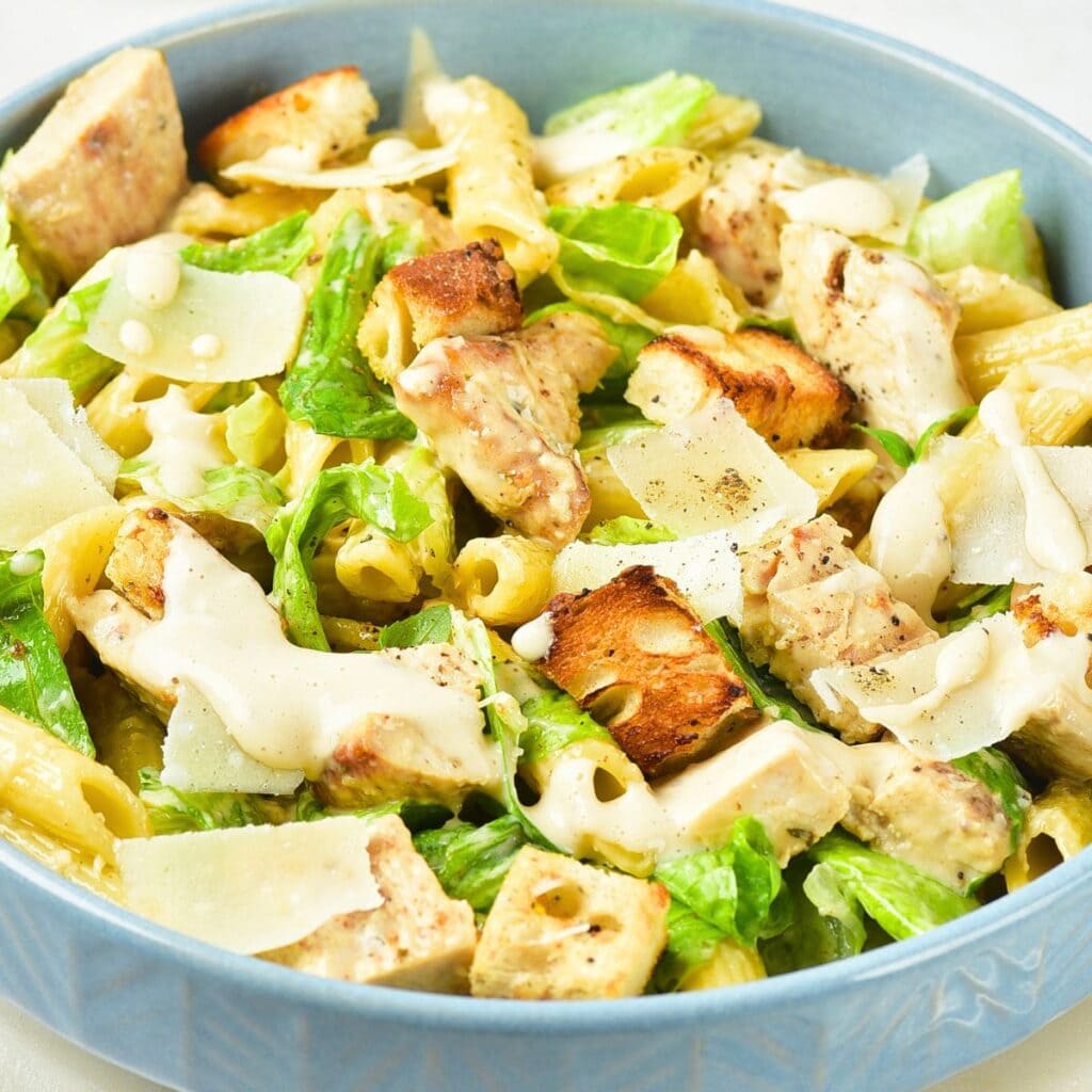 A bowl of chicken caesar pasta salad