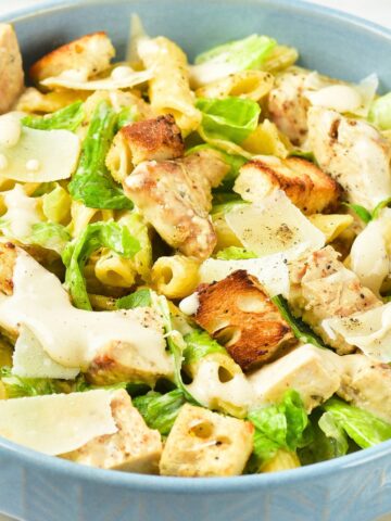 A bowl of chicken caesar pasta salad