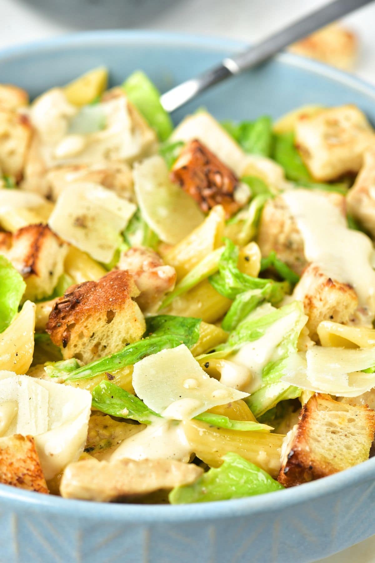 Up close view of chicken caesar pasta salad