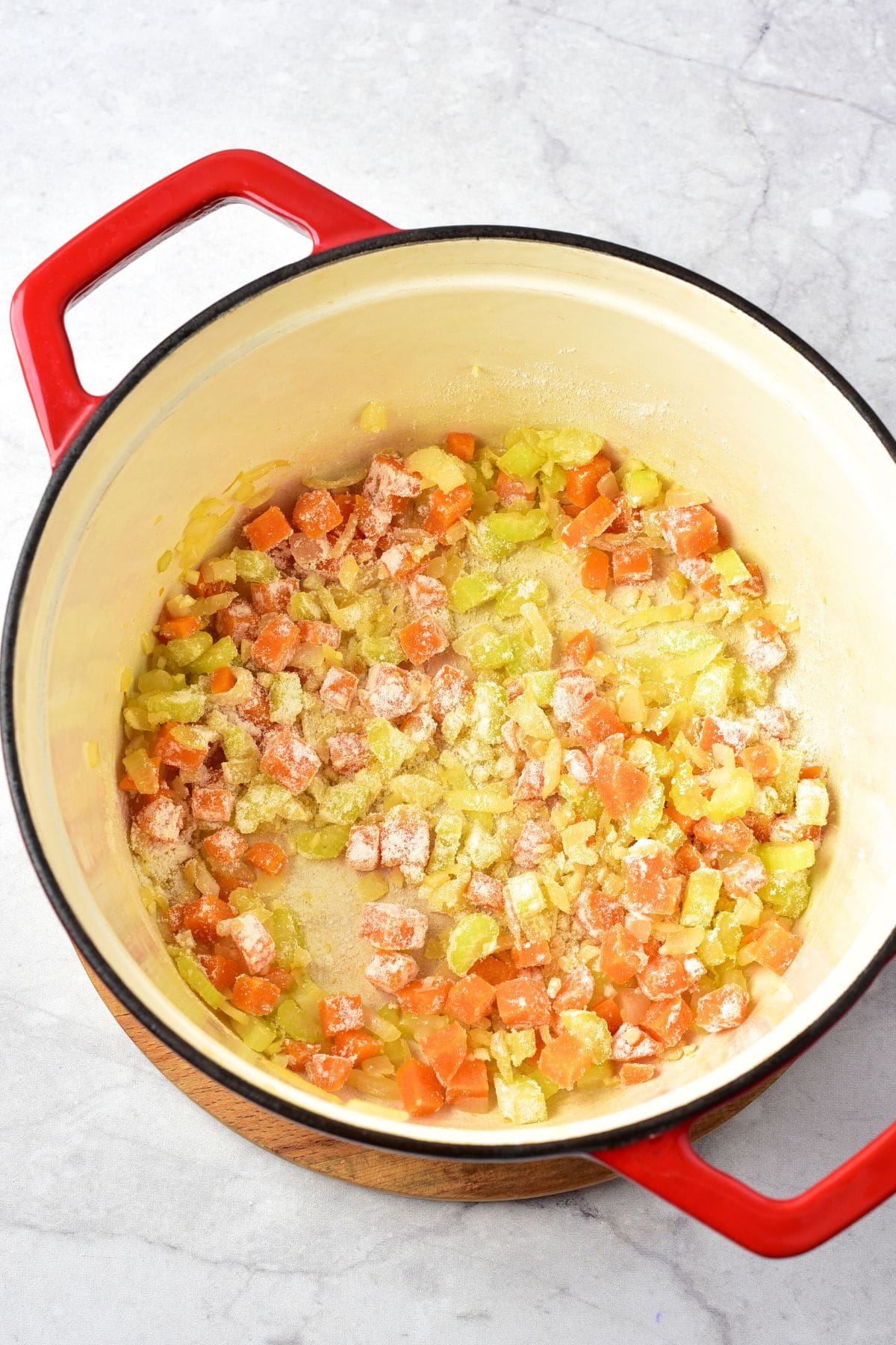 Flour sprinkled over sautéed veggies