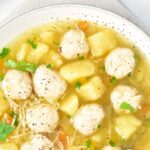 Top down view of a bowl of chicken meatballs in soup
