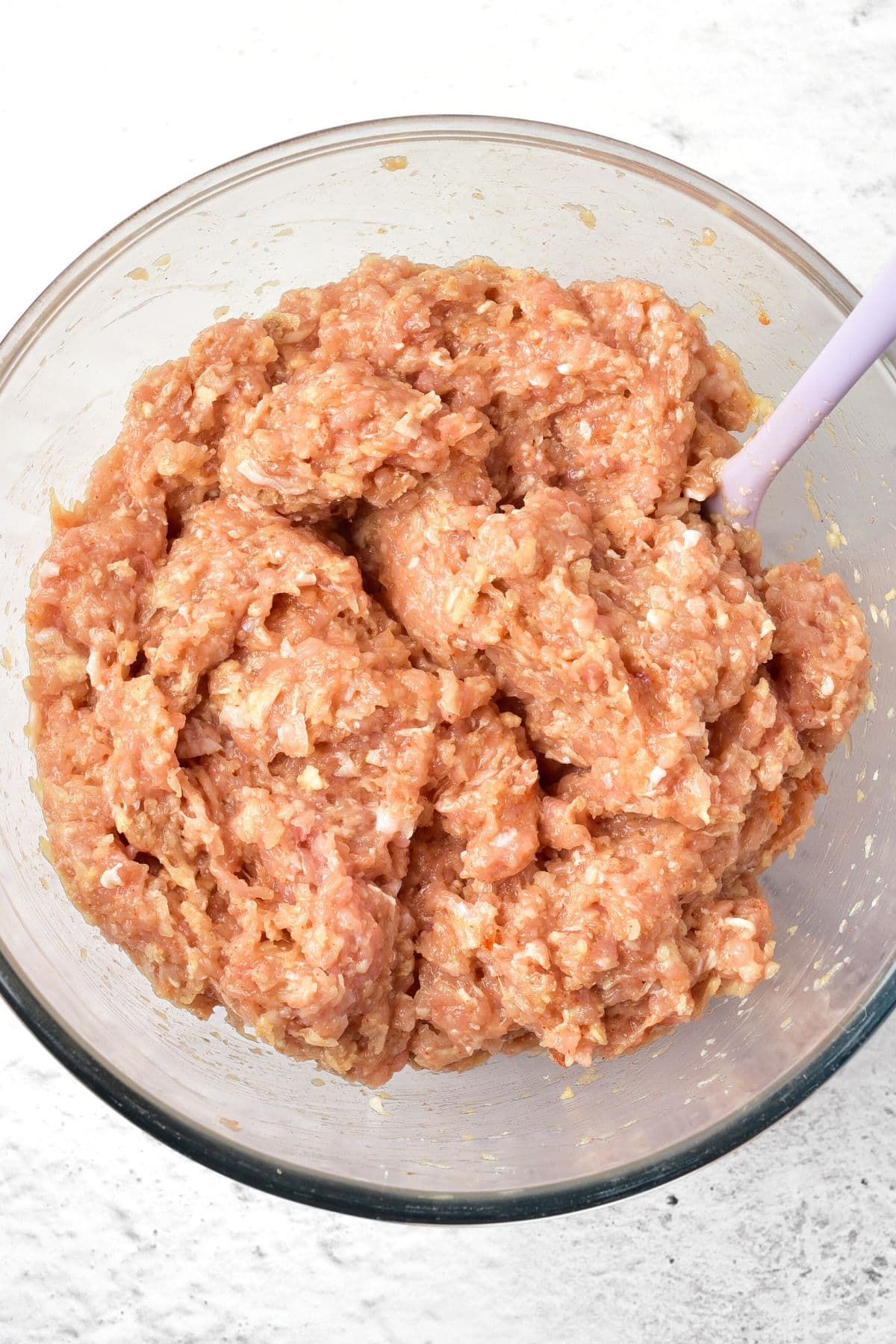 Ground chicken mixture in glass bowl