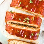Top down view of a sliced meatloaf with chicken