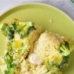 Top down view of chicken casserole on green plate.