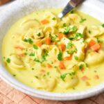 A bowl of chicken tortellini soup