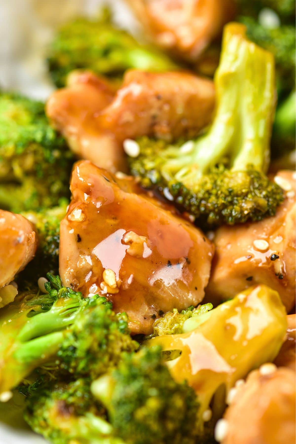 Up close view of sautéed chicken and broccoli.