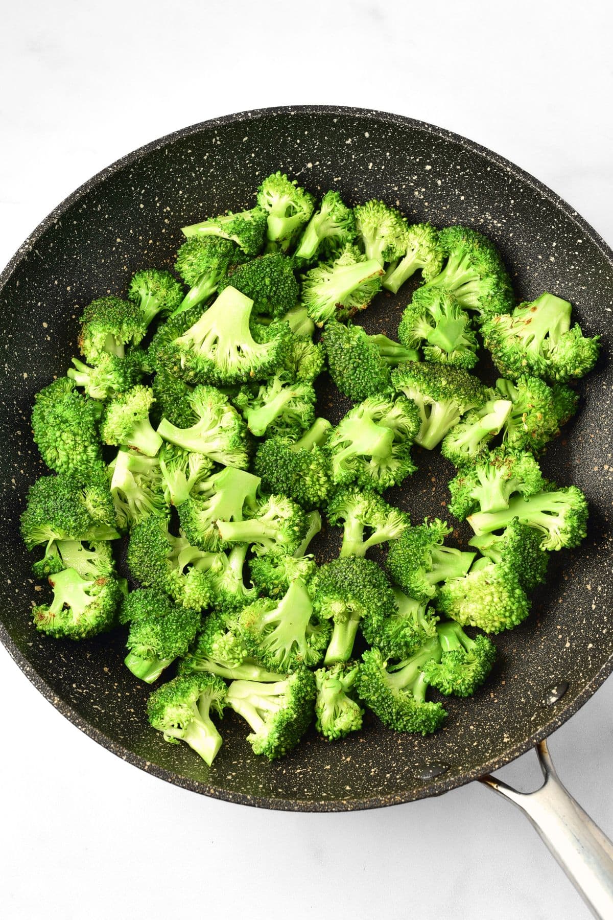 Cooking broccoli florets in skillet