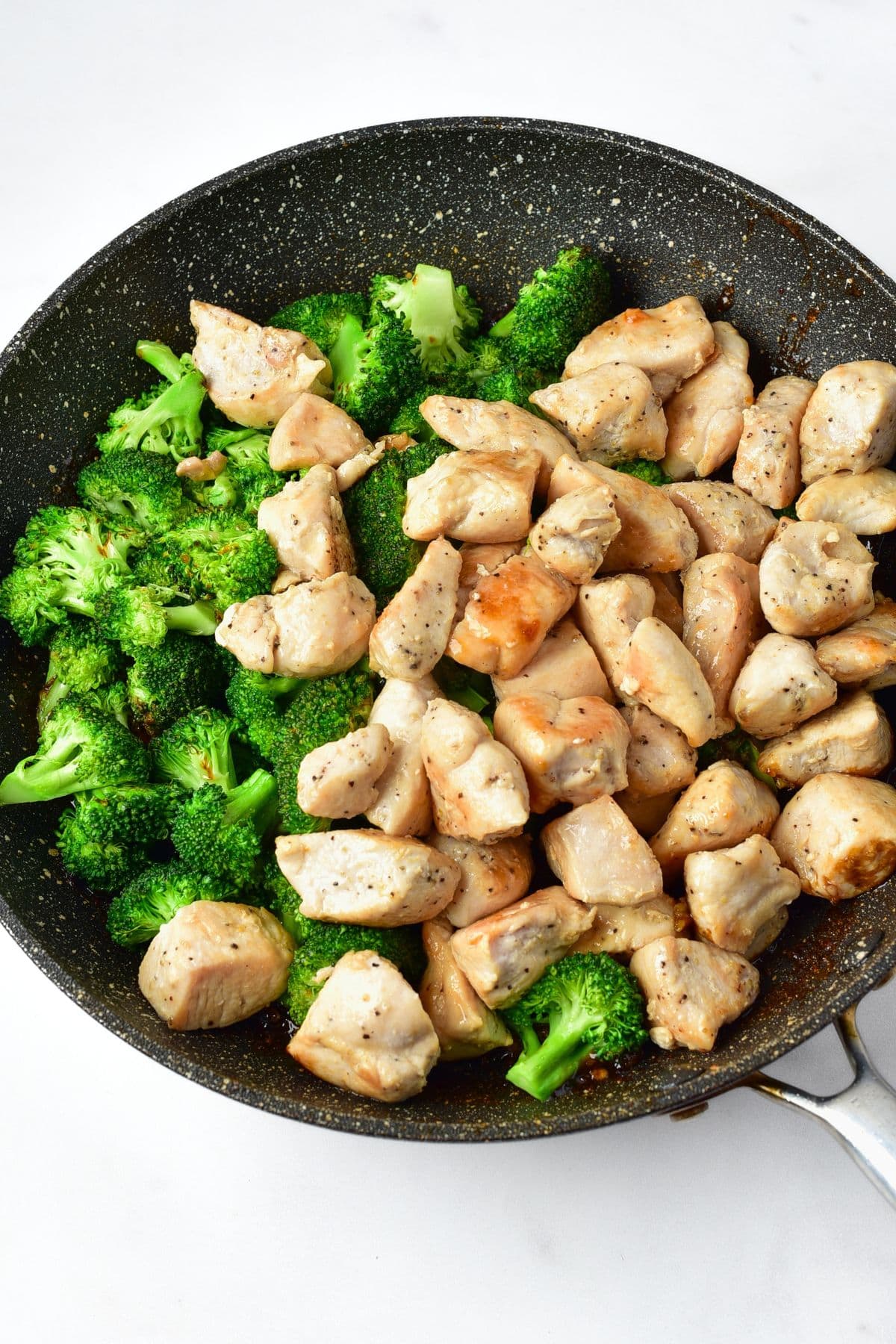 Sautéed chicken and broccoli in skillet