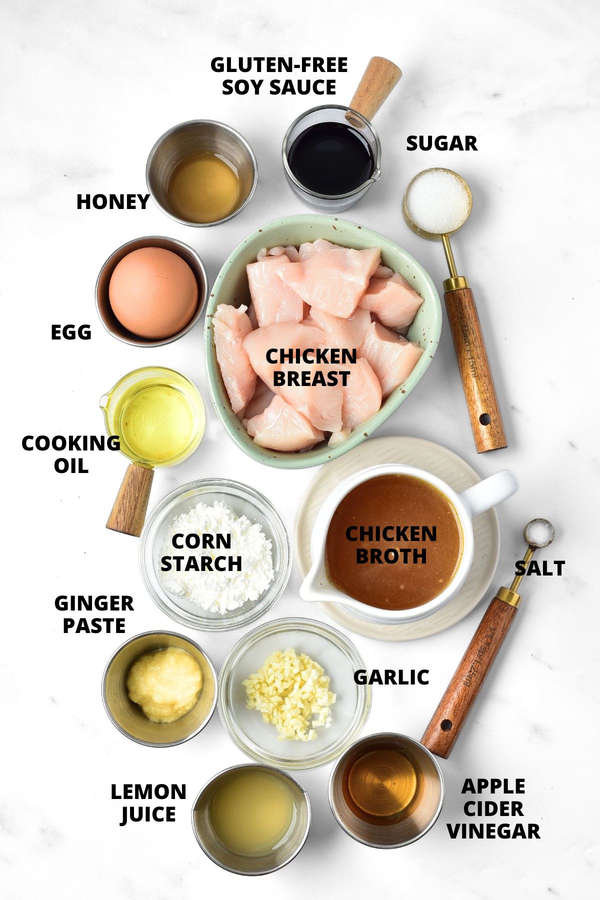 Ingredients for gluten-free Chinese lemon chicken recipe laid out on marble board.