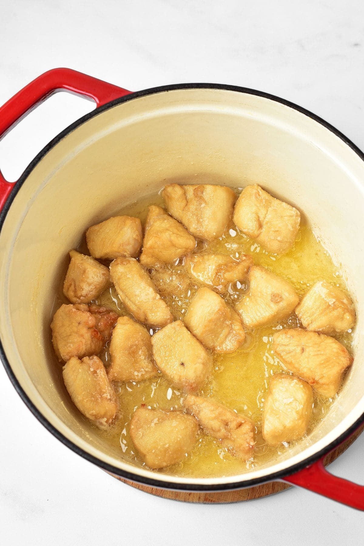 Frying chicken pieces in Dutch oven