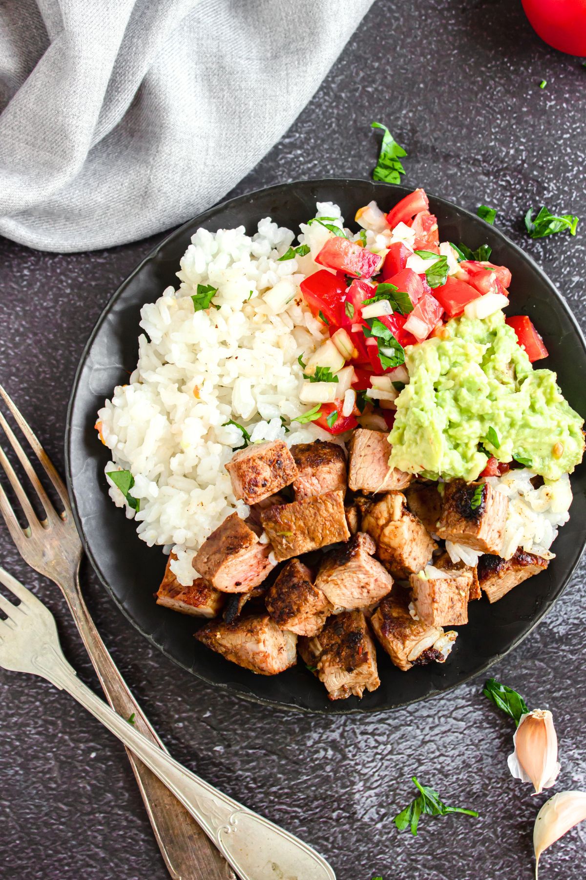Chipotle Copycat Steak Bowl Top down view of Chipotle copycat steak bowl on dark grey board