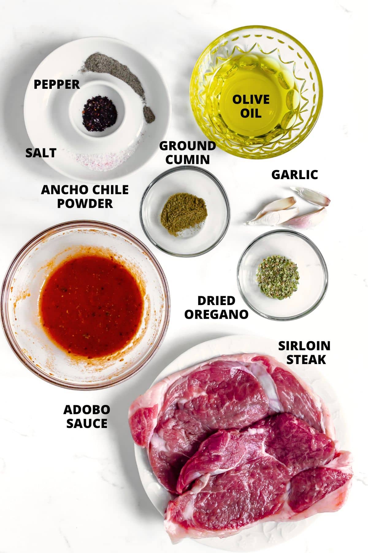 Homemade Chipotle Steak Bowl Recipe (Gluten-Free, Dairy-Free) Ingredients for homemade chipotle steak bowl recipe laid out on white board.