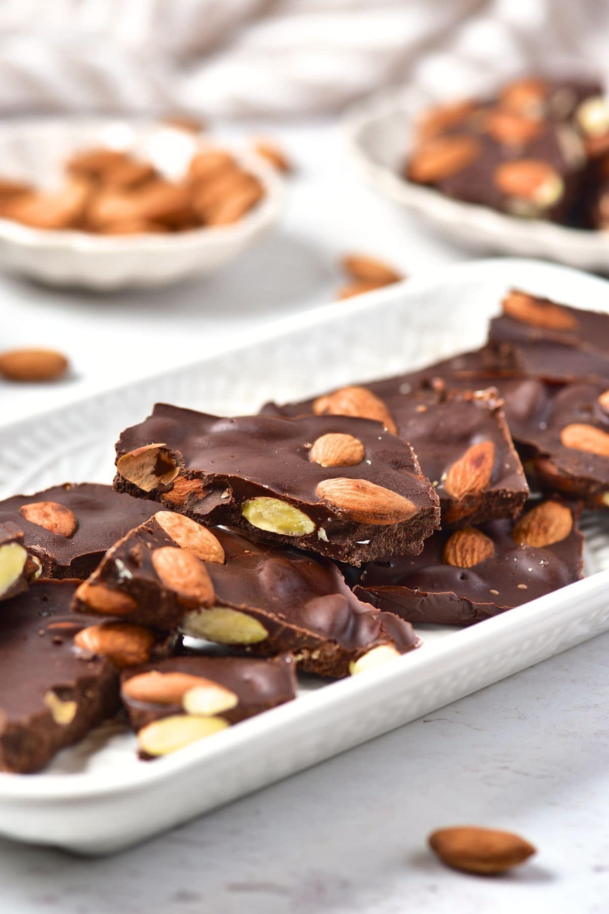 A plate of gluten-free chocolate bark with almonds