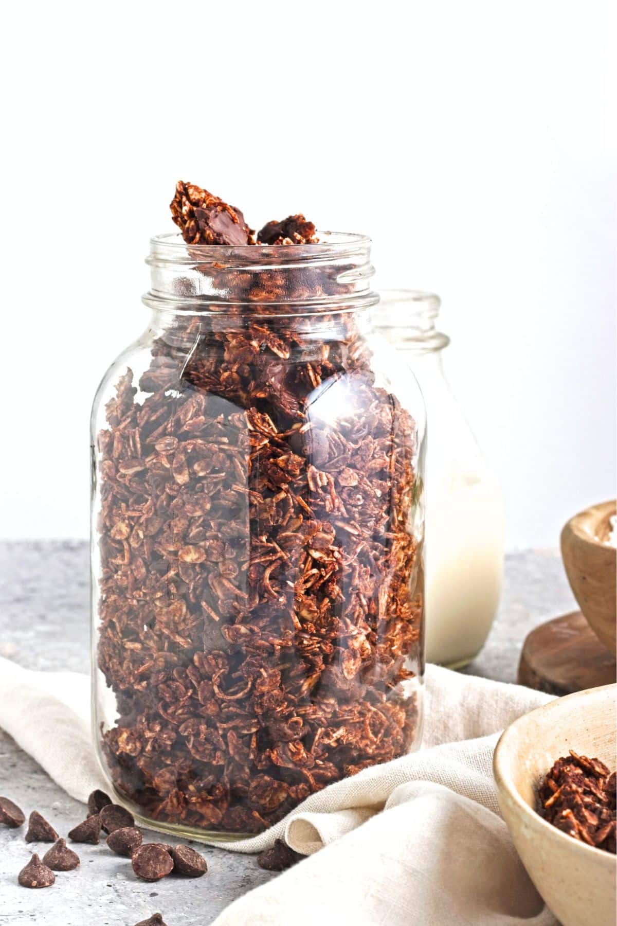 A glass jar with chocolate granola