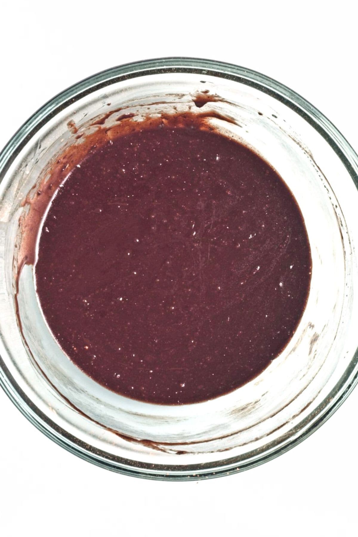 Melted dark chocolate mixture in glass bowl