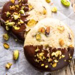 Top down view of chocolate-dipped pistachio cookies
