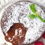 Top down view of molten chocolate spilling from lava cake