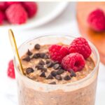 Up close view of a glass of chocolate chip overnight oats
